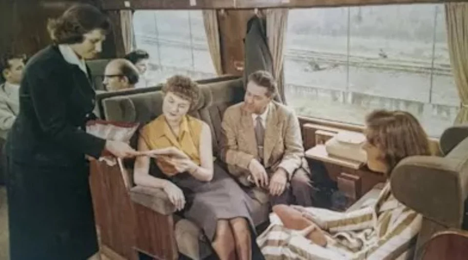 Historical photograph of a family sitting on a train