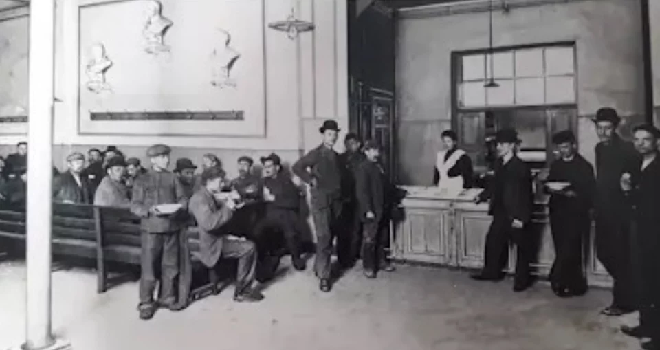Historical photograph of industrial workers in a canteen
